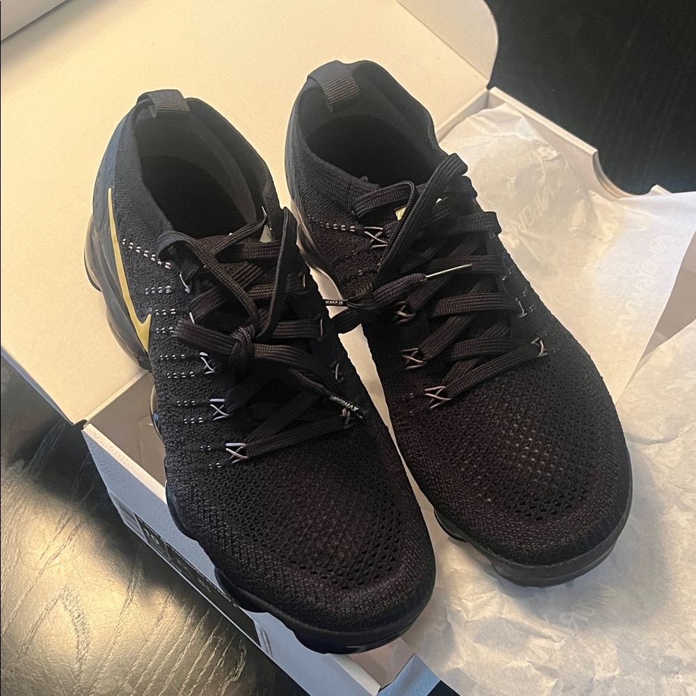Nike Woman Black and Gold Athletic Sneakers